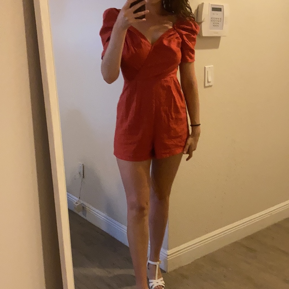 Puff sleeve blood orange colored romper
